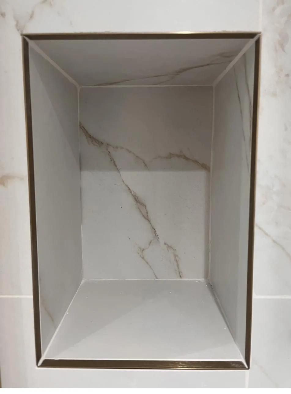Shower niche before sealant, raw tile joints
