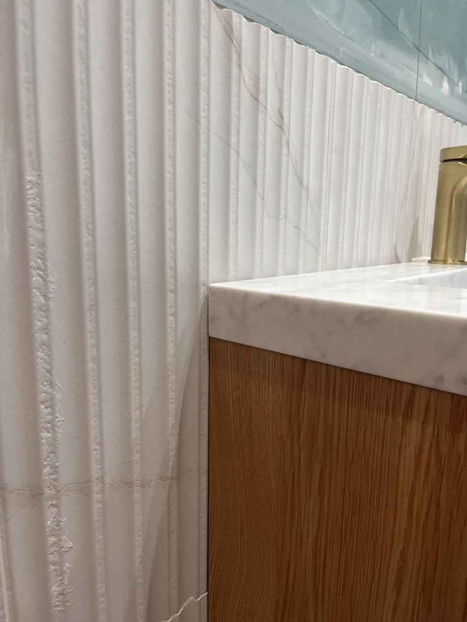 Fluted tile splashback before sealant, raw untreated joint