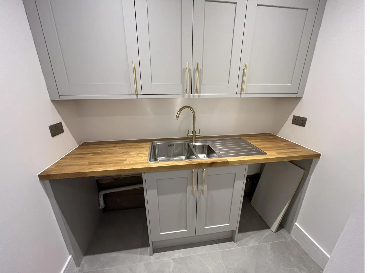 Kitchen worktop sealed neatly around a stainless steel sink